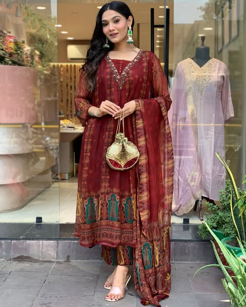 Beautiful pure premium chiffon digital printed Anarkali set with handwork on neck it has attached lining paired up with santoon slik pant and Organza digital printed dupatta sets(SWRED04)