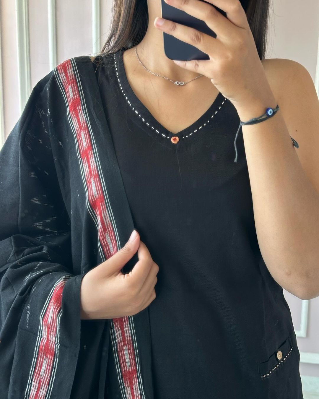 Get summer ready in our new sleevless set with ikkat print silk dupatta with attached mega sleeve available in beautiful black colour