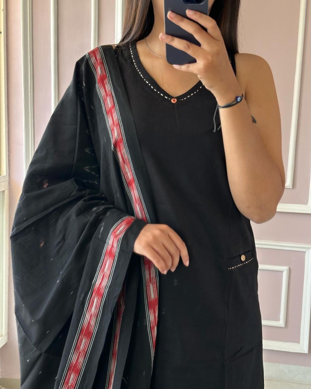 Get summer ready in our new sleevless set with ikkat print silk dupatta with attached mega sleeve available in beautiful black colour