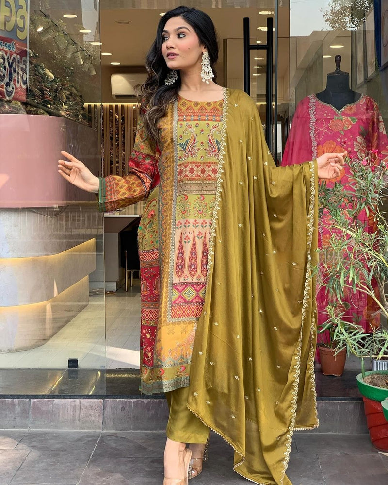 Featuring Glamorous Heavy Silk Suit Set Which is Beautifully Decorated With Intricate Handwork, Original Mirror Work And Jari Work