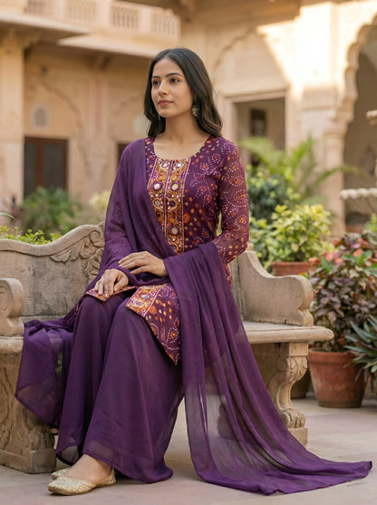 A Rich Purple And Pink Bandhani Printed Plazo set Featuring An Embroidered Front Panel, Flowy Matching Bottoms and A Sheer Dupatta For An Elegant Ethnic Look. (NFRD01)