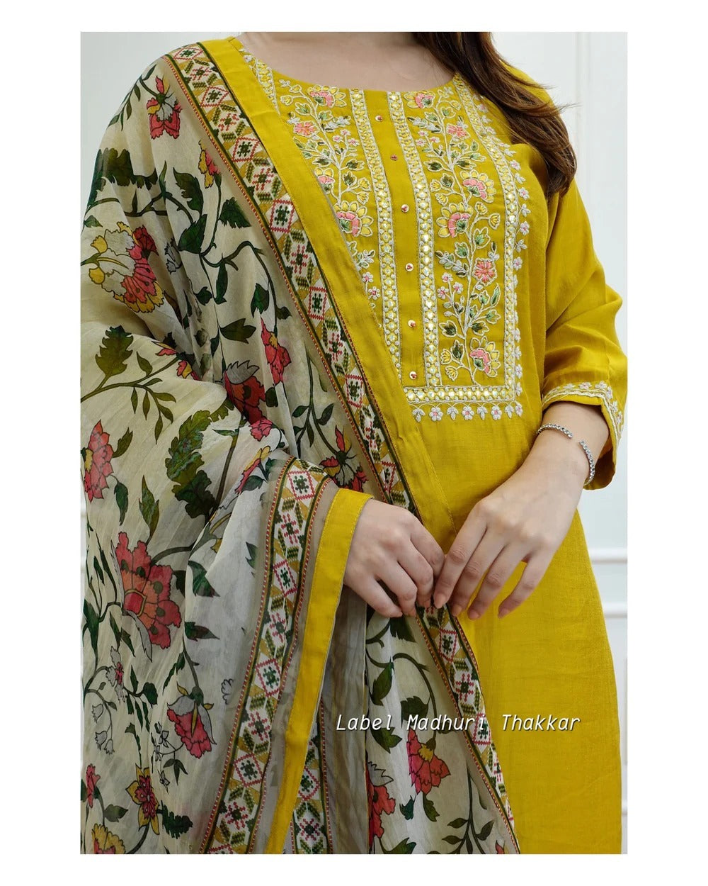 EMBROIDERY AND ADDHA WORK ON YOUK AND LESS WORK ON KURTI & PANT PRINTED MULMUL DUPPTA