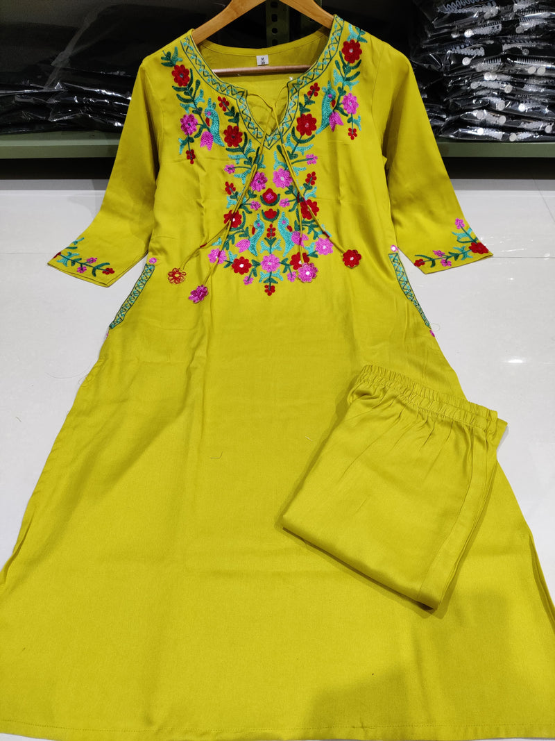 New in festive aari work kurta Plazzo set. Get your hands on our beautiful lemon green kurti with intricate thread aari