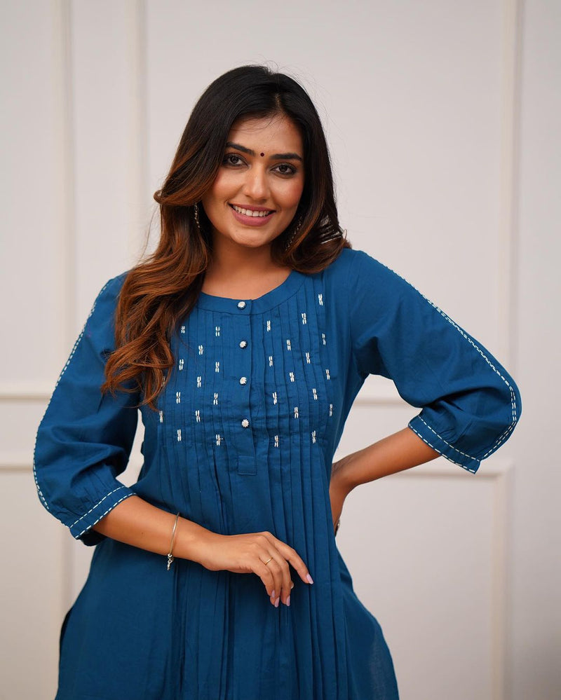Upgrade your office wear wardrobe with this classy *teal blue kurti pant with beautiful manual tagai &amp; button work detailing for all day comfort and trendy look