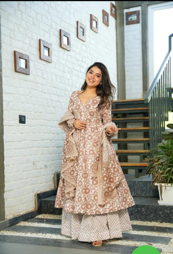 looks elegant in a stunning brown anarkali suit. The intricate embroidery adds sophistication,