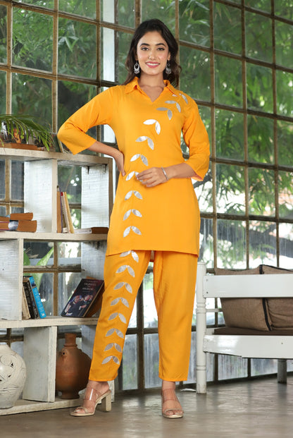 A mirror work kurti paired with pants exudes timeless charm and contemporary elegance