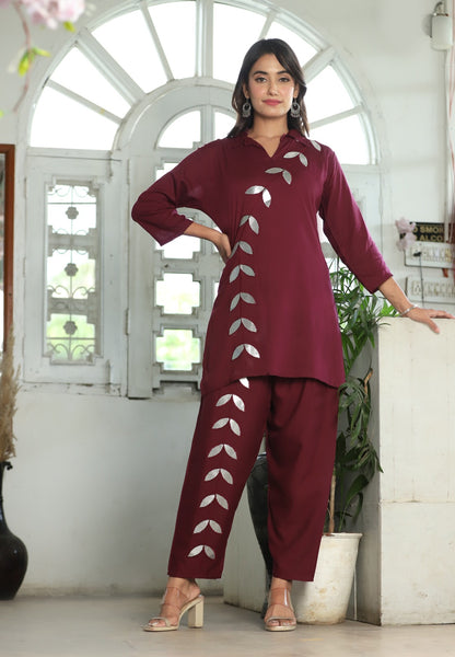 A mirror work kurti paired with pants exudes timeless charm and contemporary elegance