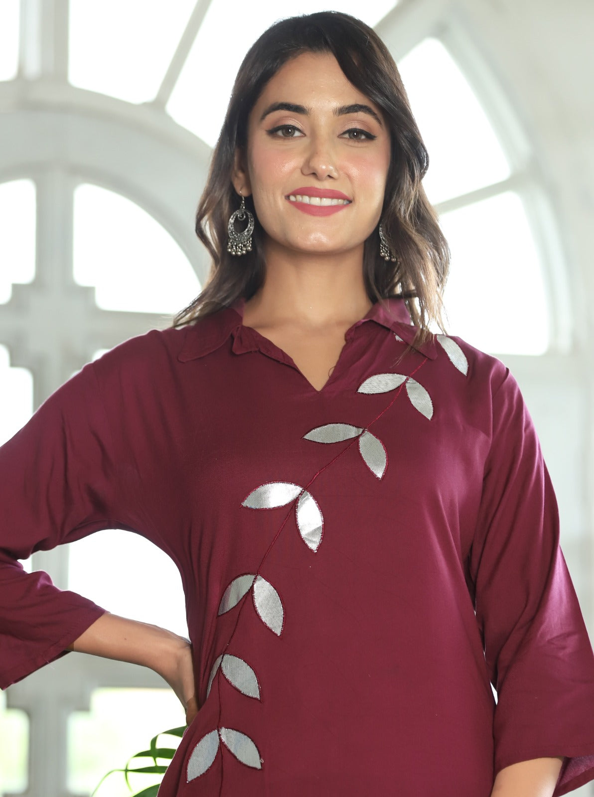 A mirror work kurti paired with pants exudes timeless charm and contemporary elegance