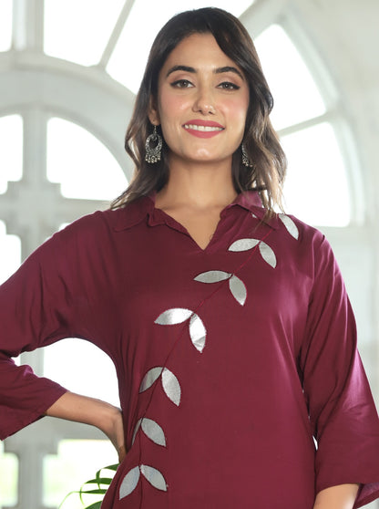 A mirror work kurti paired with pants exudes timeless charm and contemporary elegance