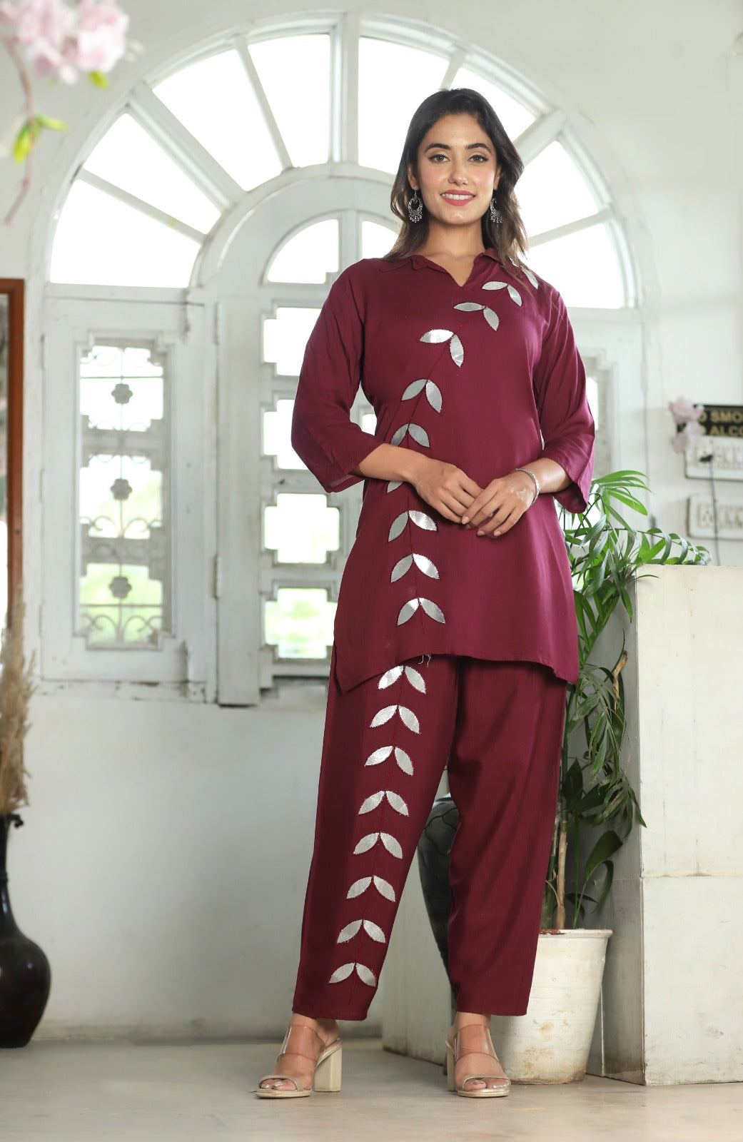 A mirror work kurti paired with pants exudes timeless charm and contemporary elegance