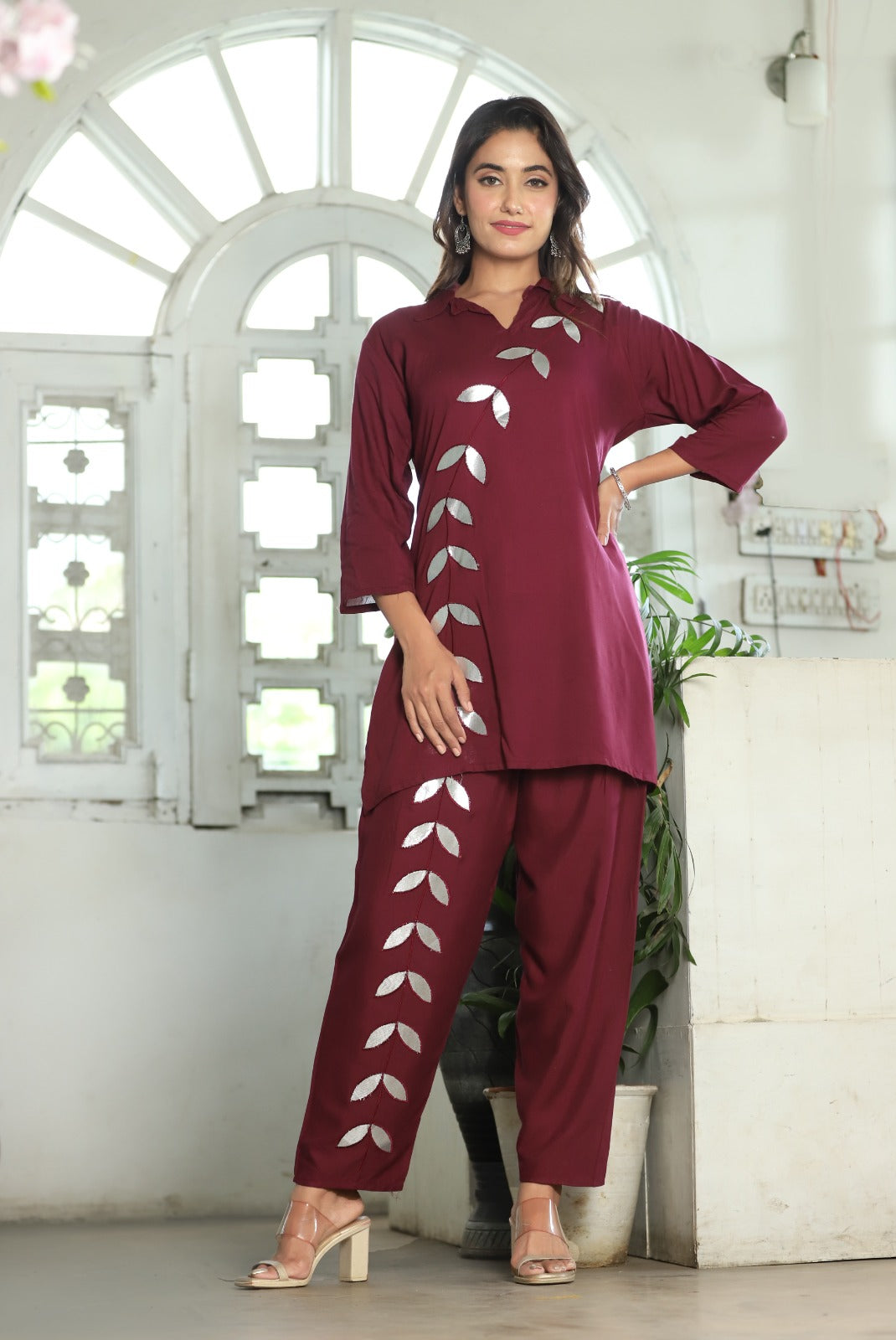 A mirror work kurti paired with pants exudes timeless charm and contemporary elegance