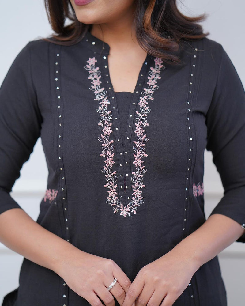 Pure cotton pleated pattern kurta with heavy embroided panels and sequence work.