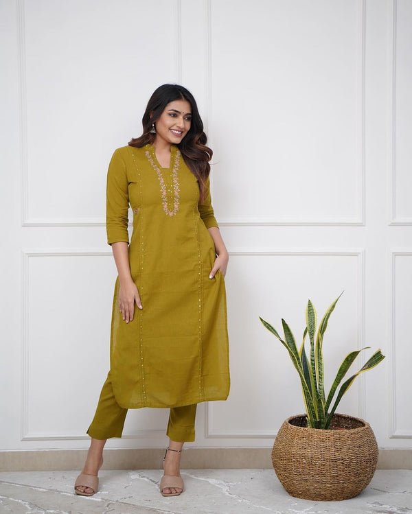 Pure cotton pleated pattern kurta with heavy embroided panels and sequence work.