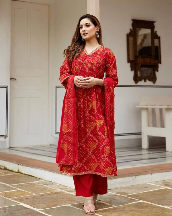 Radiate grace this Karwa Chauth in our finely crafted Red Cotton Suit with intricate embroidery and timeless Bandhani print all-over