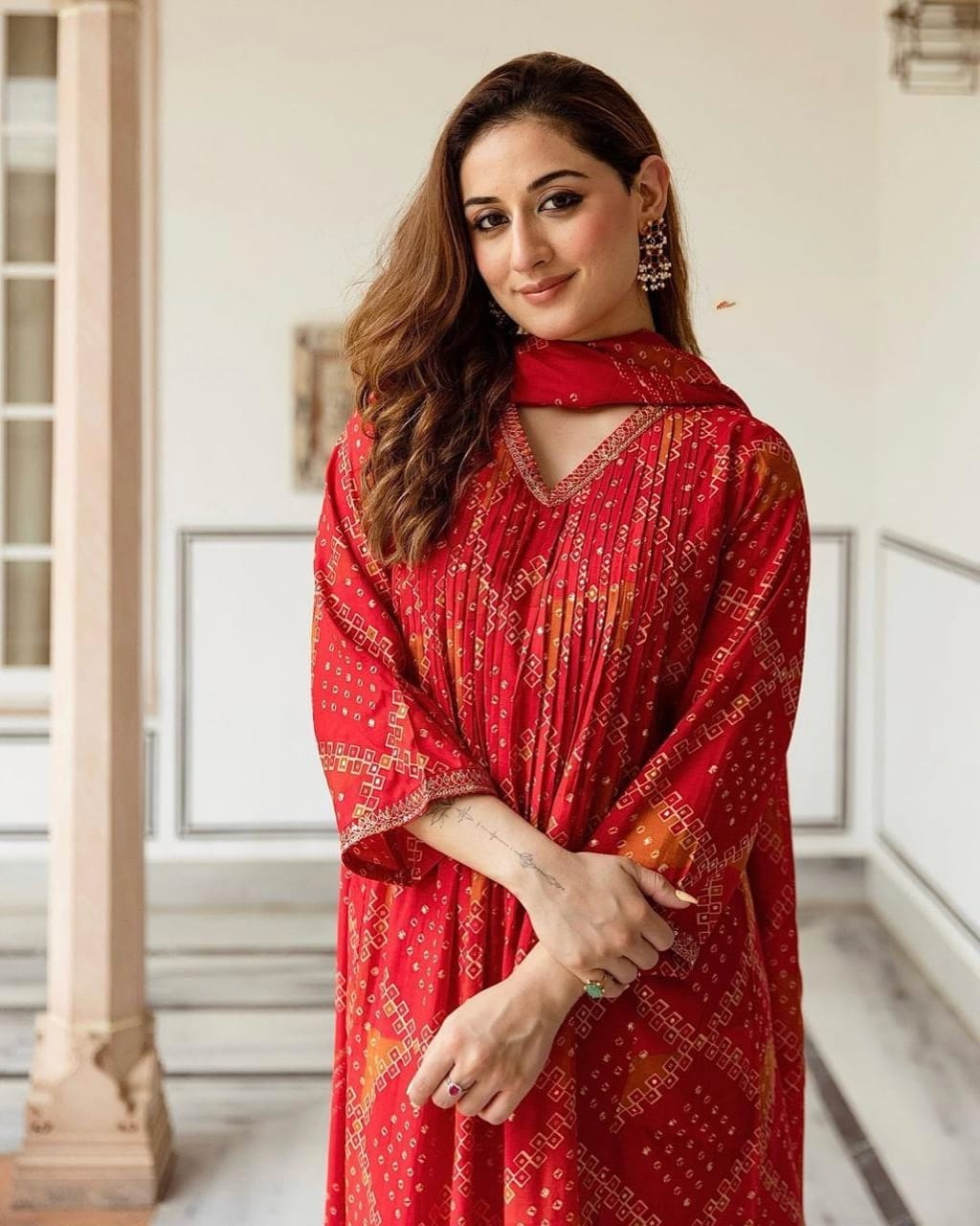 Radiate grace this Karwa Chauth in our finely crafted Red Cotton Suit with intricate embroidery and timeless Bandhani print all-over