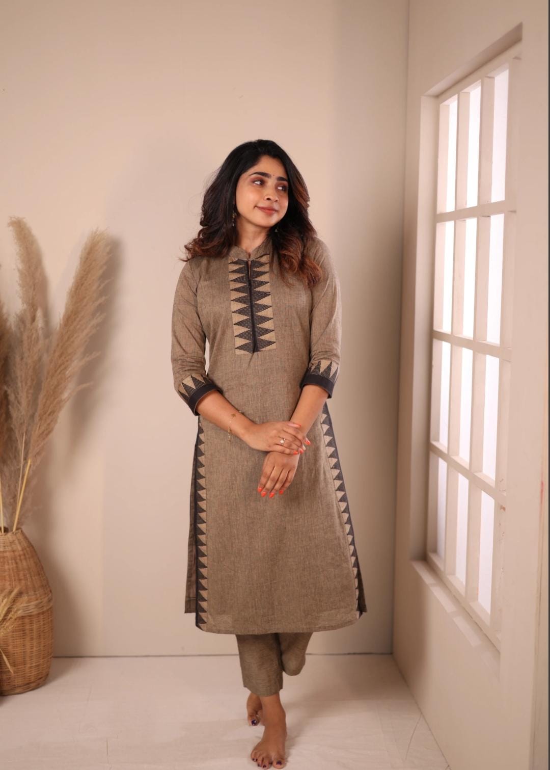 Comfort meets style in this Chettinad soft cotton kurti-pant set. The smooth texture of the fabric,