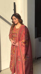 Premium cotton Anarkali suit set with hand work detailing on yoke paired with matching pant and full dupatta.