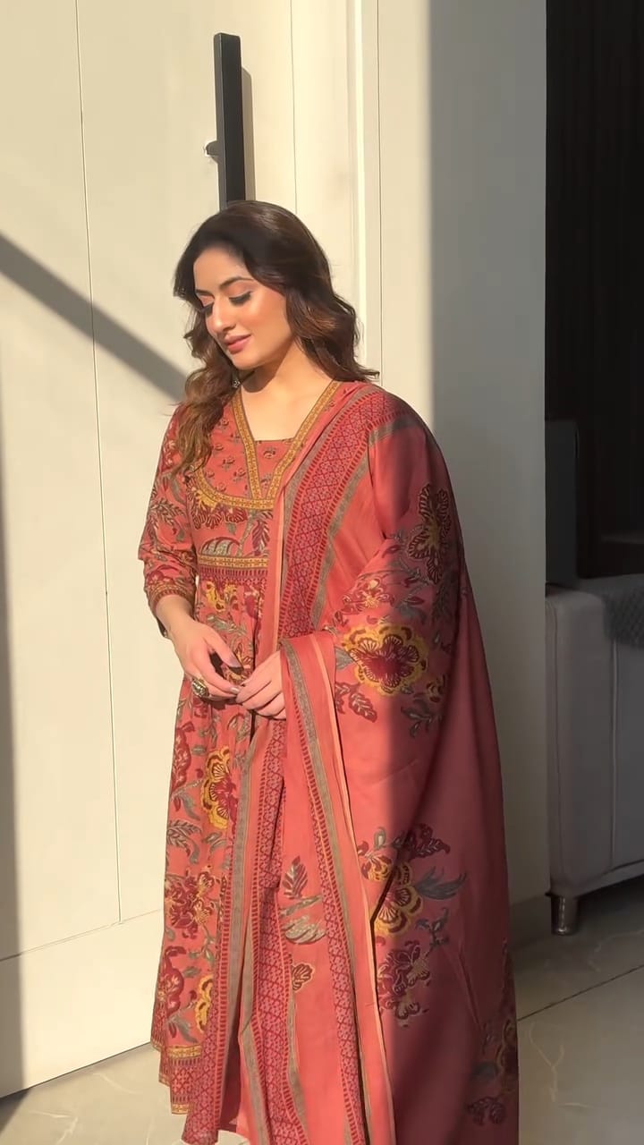 Premium cotton Anarkali suit set with hand work detailing on yoke paired with matching pant and full dupatta.