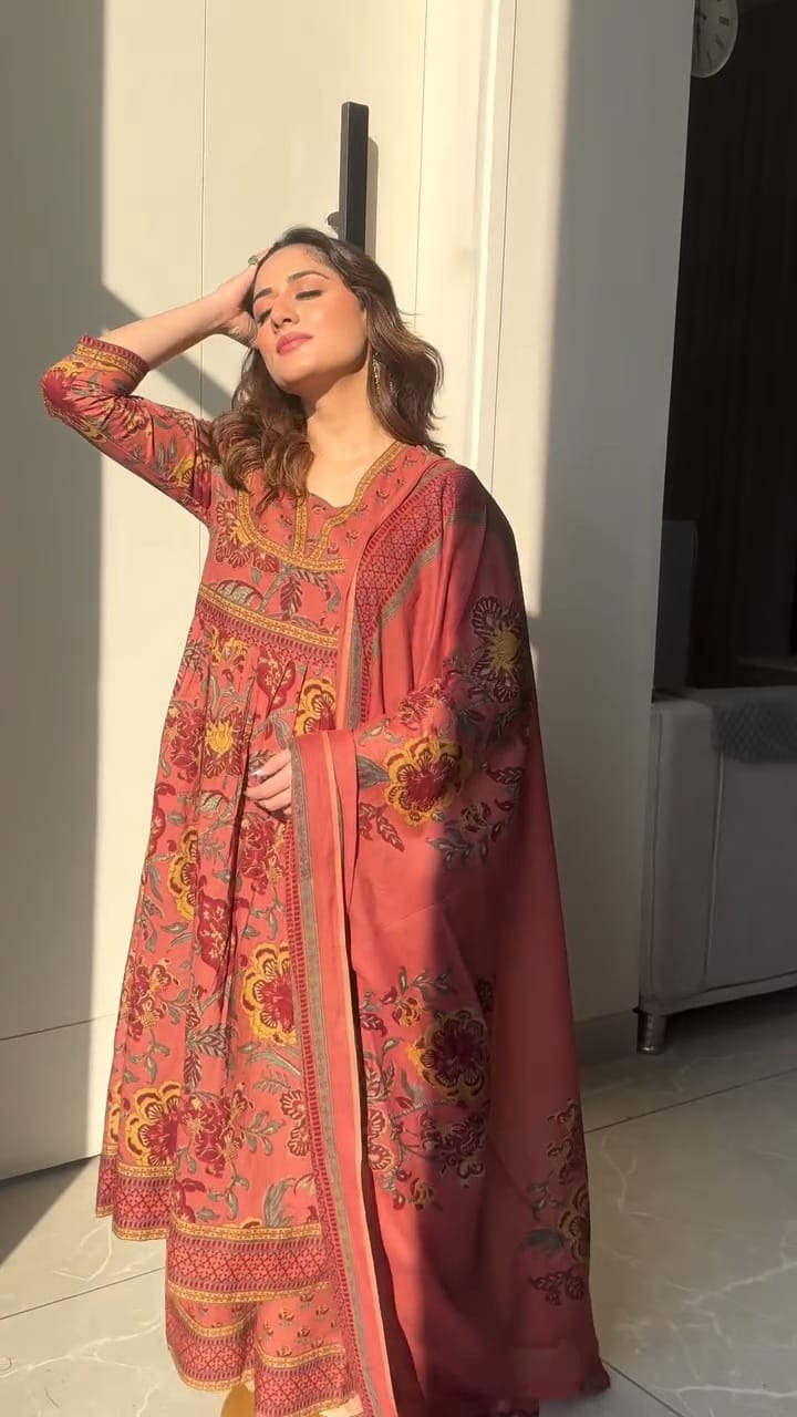 Premium cotton Anarkali suit set with hand work detailing on yoke paired with matching pant and full dupatta.