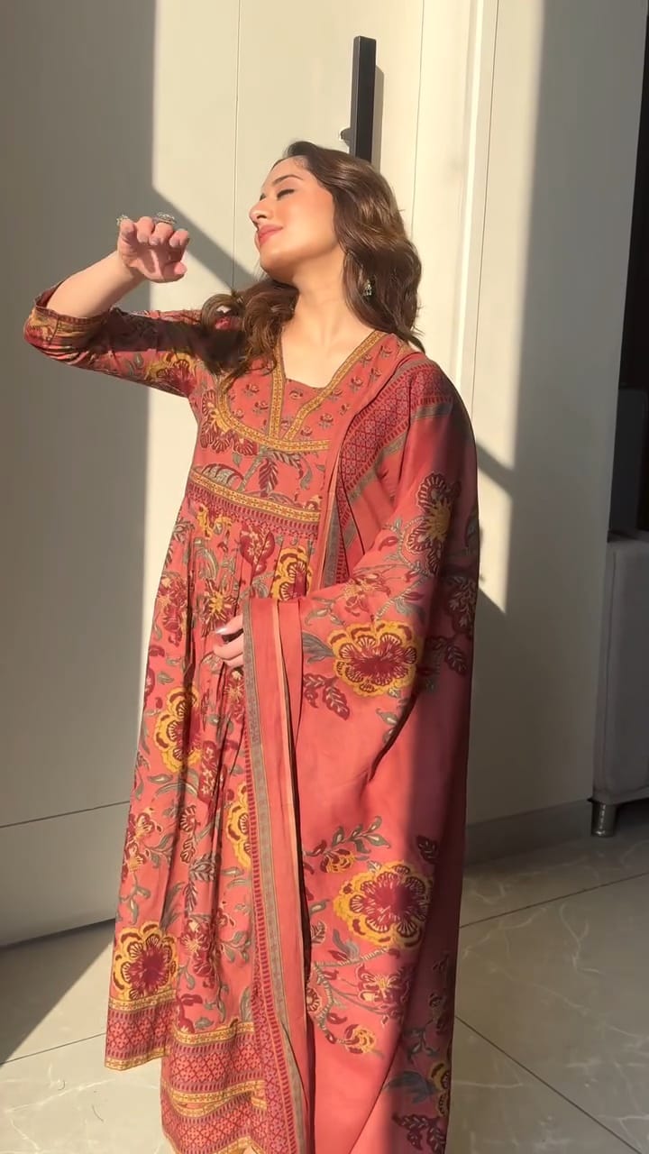 Premium cotton Anarkali suit set with hand work detailing on yoke paired with matching pant and full dupatta.