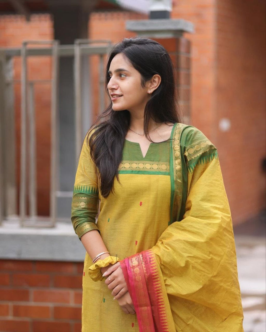 Crafted from pure Kanchi cotton, this elegant yellow ensemble is designed with love and rooted in South Indian cultural artistry. (RRRD11)