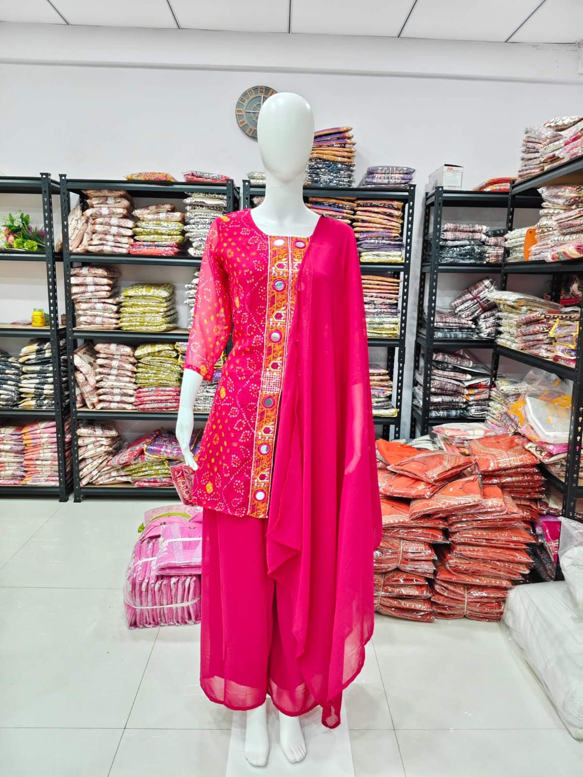 A Rich Purple And Pink Bandhani Printed Plazo set Featuring An Embroidered Front Panel, Flowy Matching Bottoms and A Sheer Dupatta For An Elegant Ethnic Look. (NFRD01)