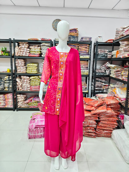A Rich Purple And Pink Bandhani Printed Plazo set Featuring An Embroidered Front Panel, Flowy Matching Bottoms and A Sheer Dupatta For An Elegant Ethnic Look. (NFRD01)
