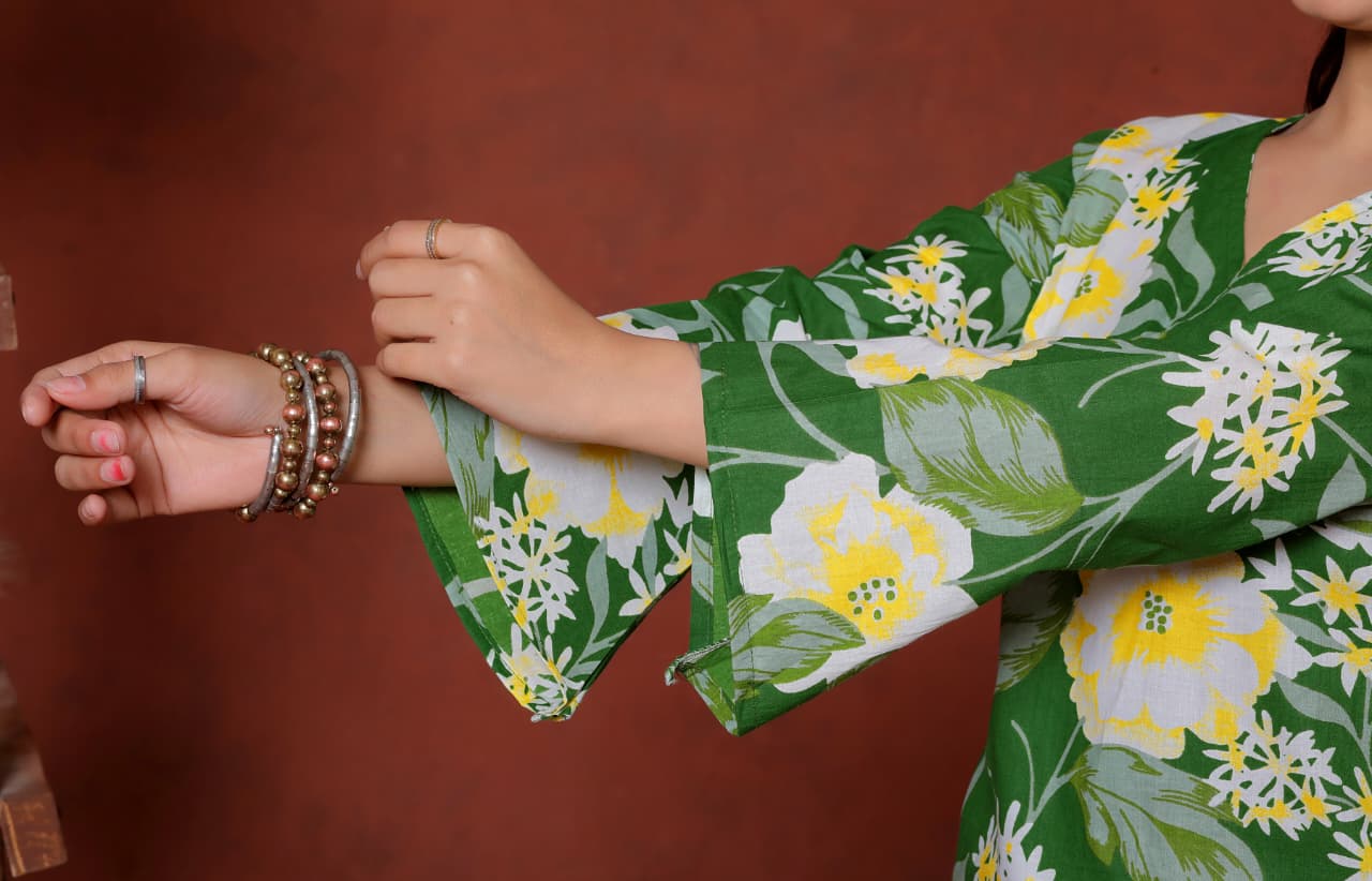 Elevate your ethnic wardrobe with this chic and vibrant fuchsia pink blue skay green  kurti. Featuring a striking white lily print, this piece is designed for the modern woman who loves a mix of classic charm and edgy details.(RRRD40)