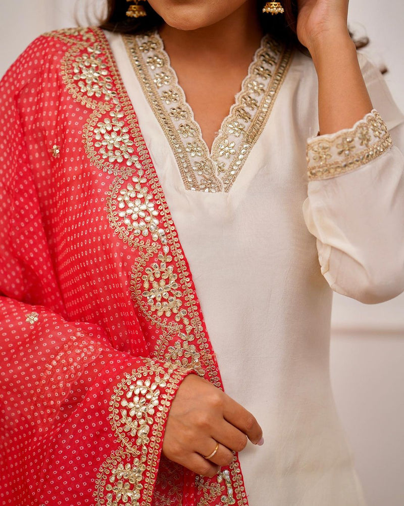 Featuring Beautiful Heavy Cotton Silk Suit Set Which is Beautifully Decorated With Original Coding Embroidery And Sequencing Satari Work. It Is Paired With Matching Pants And Six Lace Dupatta.
