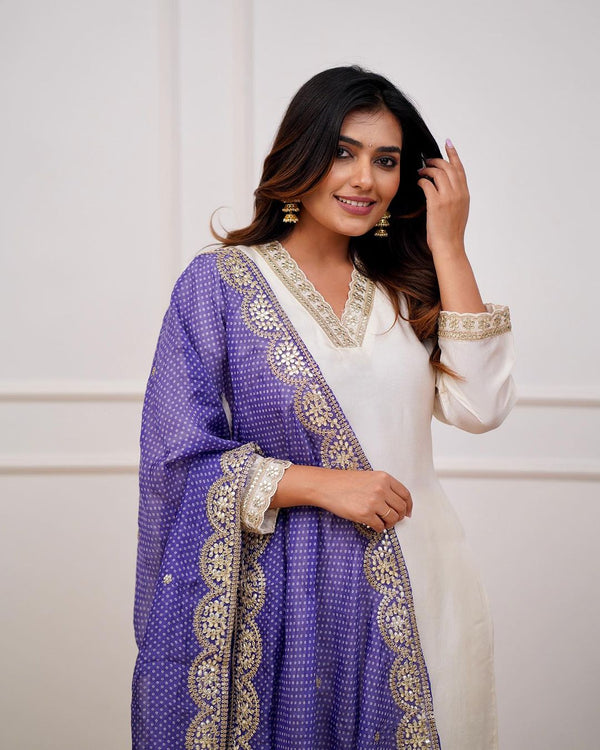 Featuring Beautiful Heavy Cotton Silk Suit Set Which is Beautifully Decorated With Original Coding Embroidery And Sequencing Satari Work. It Is Paired With Matching Pants And Six Lace Dupatta.